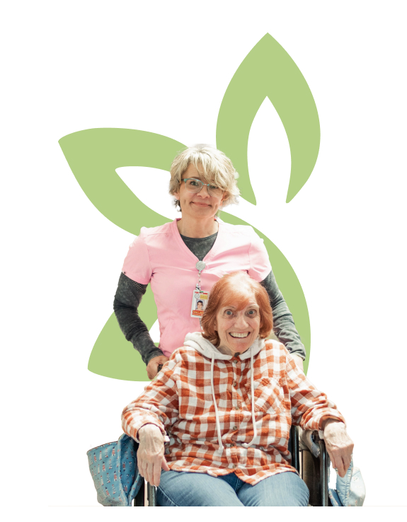 Clinical care coordinator assists a resident in a wheelchair