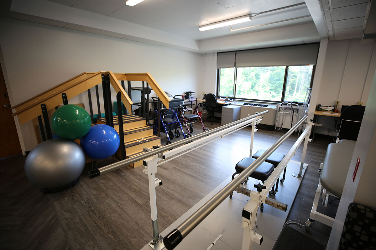 Willow Point exercise facility containing walking rails, model stairs, and exercise balls